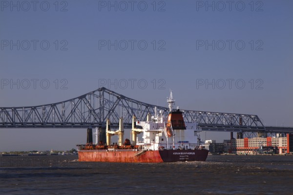 View of bridge and cargo ship in New Orleans Harbor, New Orleans, null, USA