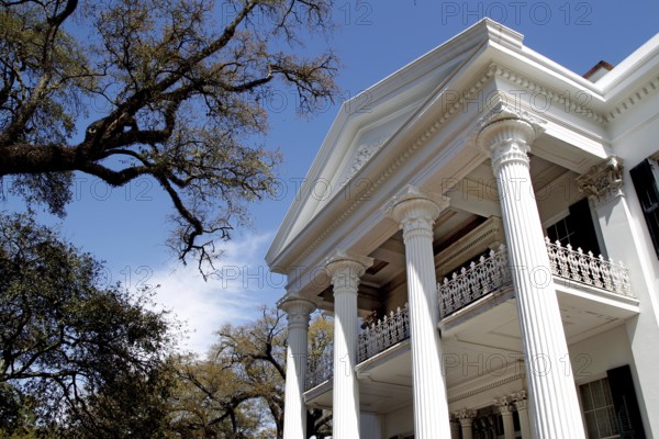Close-up of magnificent mansion with white columns and balcony, Natchez, Mississippi, USA