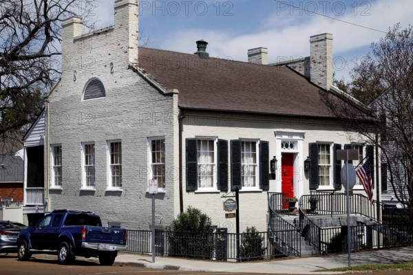 Historic house with red door in urban area, Natchez, USA