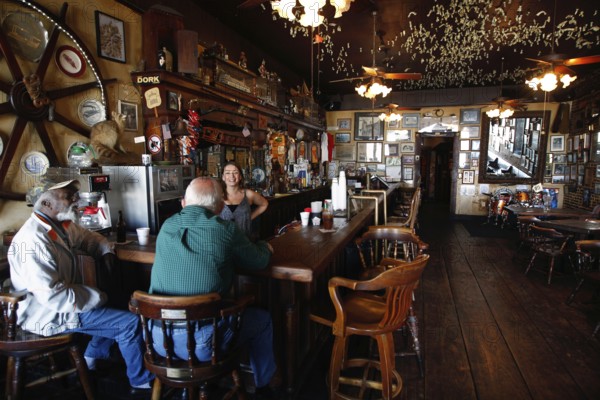 Rustic bar with cozy atmosphere and wooden furniture on Silver Street, Natchez, Mississippi, USA