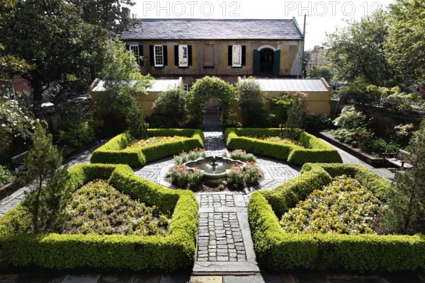 Well-maintained historic garden with symmetrical layout and a fountain, Savannah, Georgia, USA