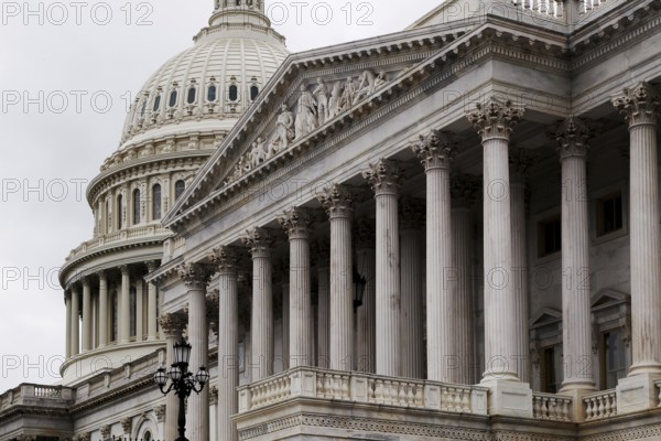 Detailed view of the Capitol with distinctive dome and column-decorated building, Washington D.C, USA