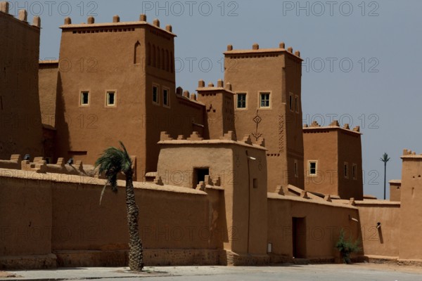 Impressive traditional architecture of Kasbah Taourirt with towers against a clear sky, Ouarzazate, Drâa-Tafilalet, Morocco