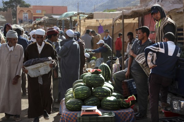 Vendors sell watermelons at a market in Msemrir, Msemrir, Morocco