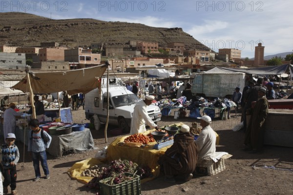 Lively market with numerous stalls and busy people in Msemrir, Msemrir, Region, MA