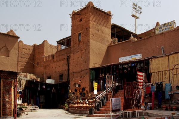 Traditional kasbah with souk, where sand-colored facades dominate the picture, Ouarzazate, Morocco