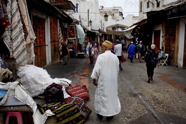 Bustling alley in the Medina of Rabat with people wearing traditional clothes, Rabat-Salé-Kénitra, Morocco