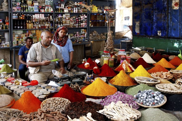 Market scene with colorful spices and vendors in Rissani, Rissani, null, Morocco