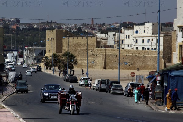 Bustling street in front of the historic city wall in the medina of Safi, Safi, Doukkala-Abda, Morocco