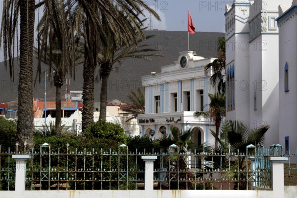 Spanish town hall flanked by palm trees in the old town of Sidi Ifni, Sidi Ifni, Guelmim-Oued Noun region, Morocco