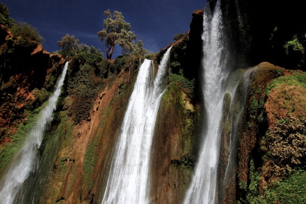 Majestic waterfalls of Ouzoud surrounded by lush vegetation and rocks, Ouzoud, Morocco