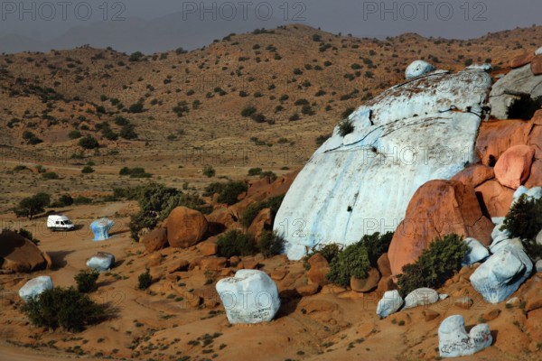Painted rocks in the vast desert landscape of Tafraoute, created by Jean Verame, Tafraoute, Souss-Massa, Morocco