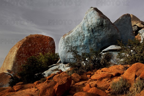 Blue painted stones in the barren desert landscape of Tafraoute by Jean Verame, Tafraoute, Souss-Massa, Morocco