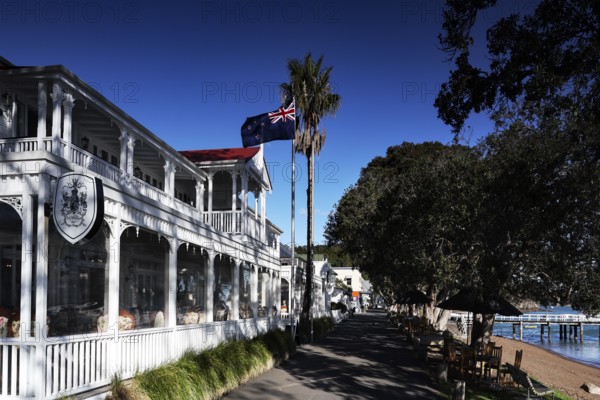 Duke of Marlborough Hotel in Russel, historic architecture with flag and palm trees, Russel, Northland, New Zealand