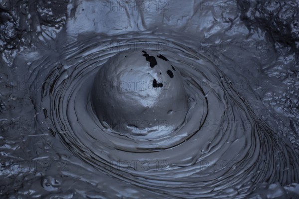 Bubbling mud hole in Whakarewarewa geothermal area, showing raw forces of nature, Rotorua, North Island, New Zealand
