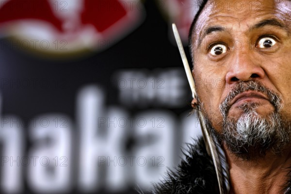 Close-up of a Maori man with intense expression during a cultural performance, Rotorua, Bay of Plenty, New Zealand