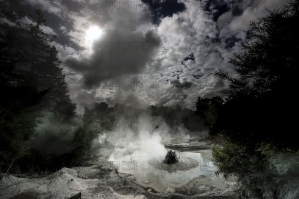 Steaming geothermal area near Waiotapu with active mud springs and dramatic skies, Waiotapu, Bay of Plenty, New Zealand