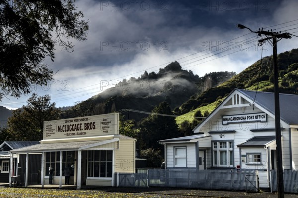 View of the quiet town view of Whangamomona with mountains and cloudy sky, Whangamomona, New Zealand