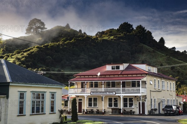 A historic hotel in Whangamomona with surrounding mountains in the background, Whangamomona, New Zealand