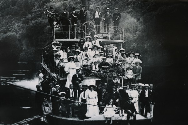 Historical photo of people on a boat on the Whanganui River, Whanganui River, Manawatu-Wanganui, New Zealand