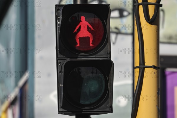 Red pedestrian light shows a male Haka dancing in Wellington, Wellington, New Zealand