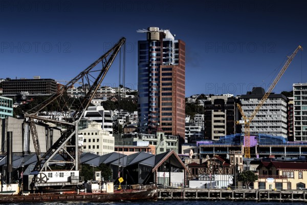 Harbour view with crane and modern buildings on Wellington Waterfront, Wellington, North Island, New Zealand