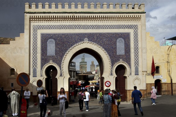 Bab Boujeloud in Fez with traditional mosaics and numerous passers-by, Fez, Fez el Bali, Morocco