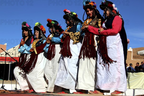 Women in traditional dress dance in sync at the Berber Festival, Ma El Kelâa m'Gouna, Fête des Roses, Berber Dances