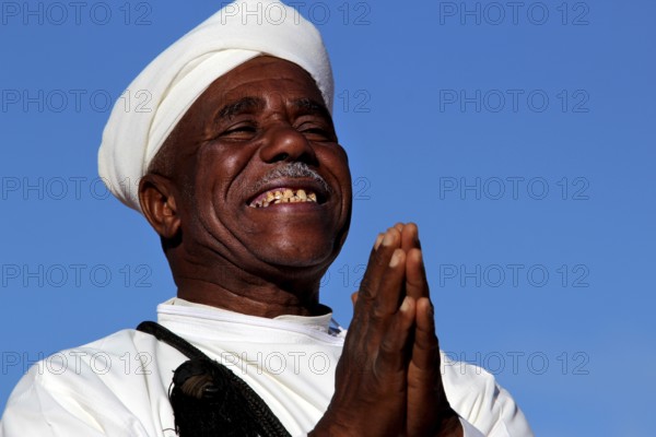 A man smiles happily at the traditional Berber festival, Ma El Kelâa m'Gouna, Fête des Roses, Berber Dances