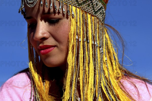 Close-up of a woman wearing a traditional headdress at the Berber festival, Ma El Kelâa m'Gouna, Fête des Roses, Berber Dances