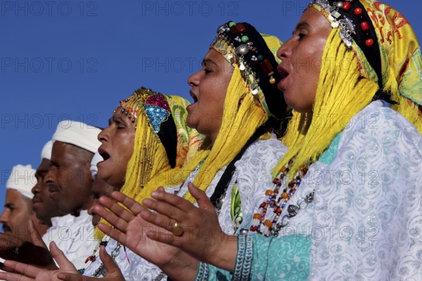 Women sing in traditional dress at the Berber Festival, Ma El Kelâa m'Gouna, Fête des Roses, Berber Dances
