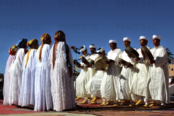 Women in traditional clothes dance on stage at the Berber Festival, Ma El Kelâa M'gouna, Fête des Roses, Berber Dances