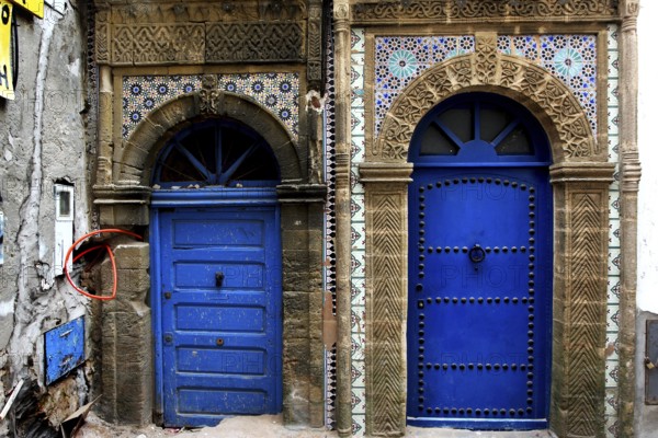 Two ornately decorated blue doors in the old town of Essaouira, Essaouira, Morocco