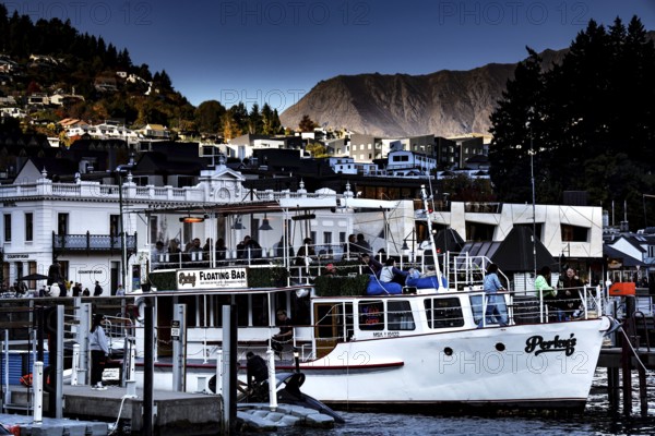 Queenstown harbour with boats and city in the background, Queenstown, New Zealand