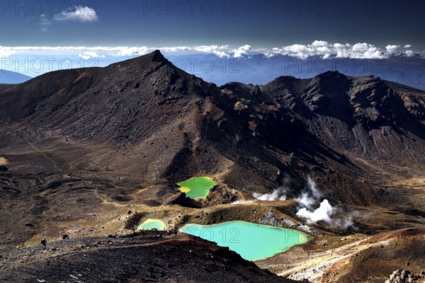 Brilliant green Emerald Lakes amidst steep volcanic landscape, Tongariro National Park, New Zealand