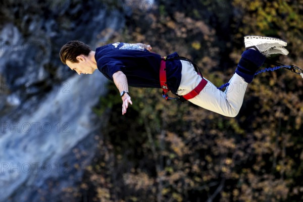 Jumper in horizontal prone position freefall over breathtaking landscape, Queenstown, Kawarau Bridge, New Zealand