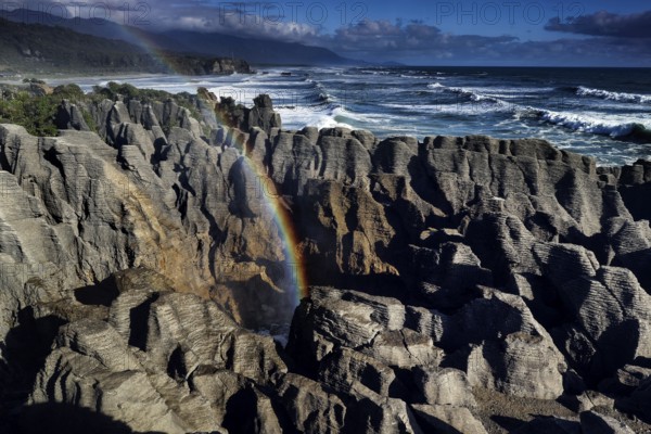 Pancake Rocks near Punakaiki with Rainbow and Blowhole, Punakaiki, West Coast, New Zealand