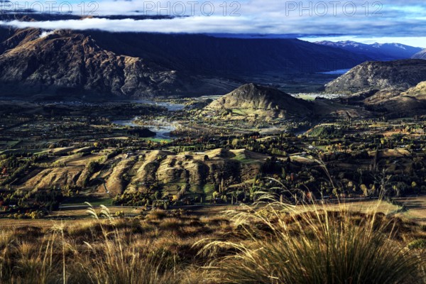 Extensive view of valleys and mountains from Coronet Peak, Queenstown, New Zealand