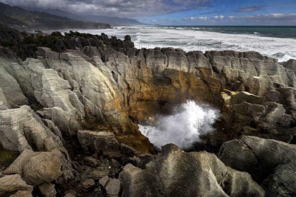 Thundering waves hit the Pancake Rocks near Punakaiki, Punakaiki, West Coast, New Zealand