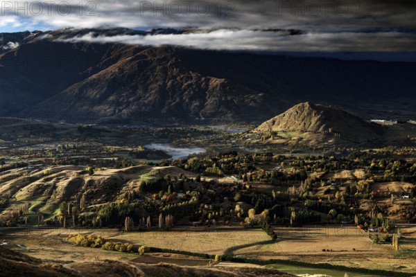 Breathtaking views from Coronet Peak with majestic mountains and dramatic clouds, Queenstown, Otago, New Zealand
