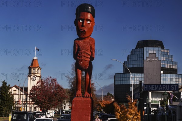 Maori figure and clock tower in Arawa Street, Rotorua, Rotorua, Bay of Plenty, New Zealand