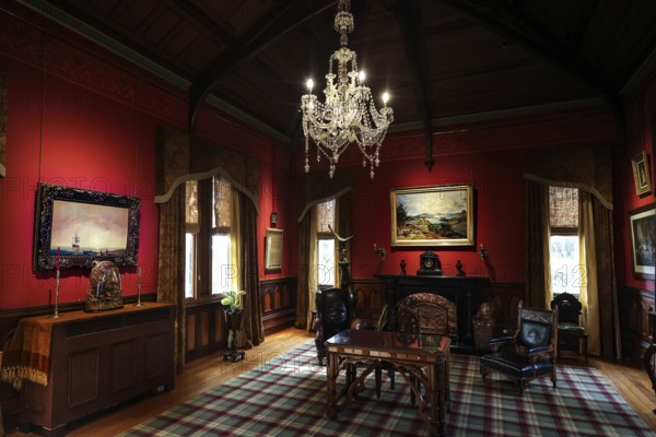 Sumptuous room in the castle with antique furniture and a large chandelier, Larnach Castle, Otago Peninsula, New Zealand
