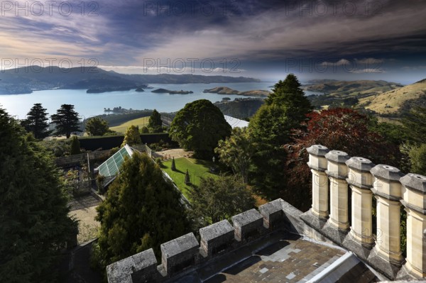 View from Larnach Castle tower across manicured gardens to the coast, Otago Peninsula, New Zealand