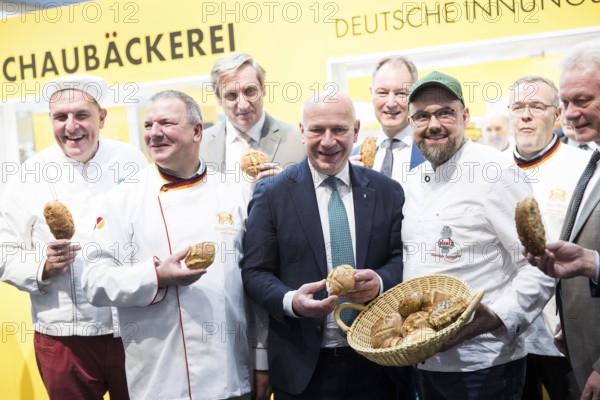 Kai Wegner (Governing Mayor of Berlin) with bread rolls at the stand of the German Guild Bakers during the opening tour of the Green Week at the exhibition grounds in Berlin on 16 January 2026. The trade fair for the agricultural and food industry will take place from 16 to 25 January 2026