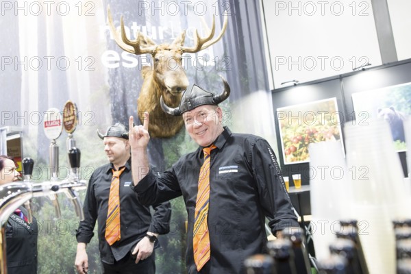 Two men wearing helmets at the Estonian stand at the Green Week at the exhibition center in Berlin on 16.01.2026. The Agricultural and Food Industry Fair will take place from January 16-25, 2026