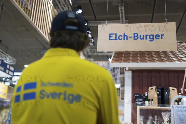 A sign indicates the sale of elk burgers at Sweden's stand at the Green Week at the exhibition center in Berlin on 16.01.2026. The Agricultural and Food Industry Fair will take place from January 16-25, 2026