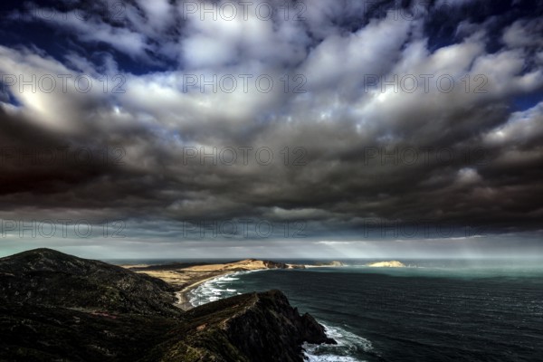 Dramatic sky over Cape Reinga and the New Zealand coastline, Cape Reinga, Ninety Miles Beach, New Zealand