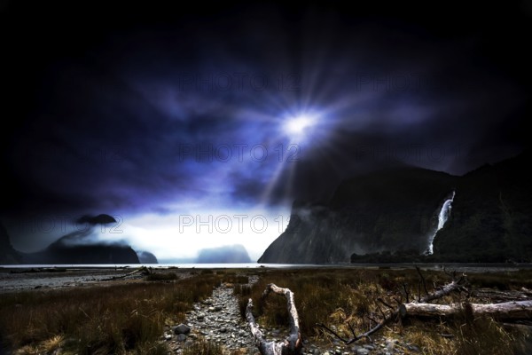 Glowing moonrays plunge Milford Sound into a mysterious atmosphere and illuminate the landscape, zero