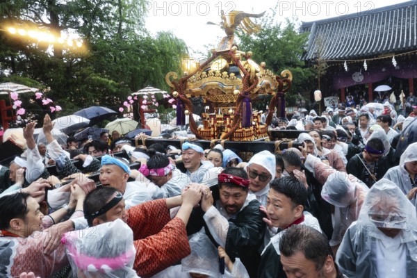 Crowd in rainy weather at Sanja Matsuri in Asakusa, Tokyo, Japan
