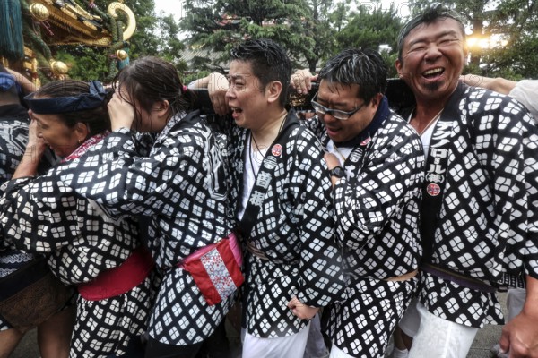 Happy Sanja Matsuris participants in traditional Japanese clothing, Tokyo, Japan
